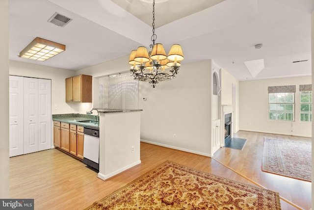8075 Lacy Dr Unit 303, Manassas, VA 20109 - kitchen featuring visible vents, light wood-style flooring, open floor plan, white dishwasher, and a notable chandelier