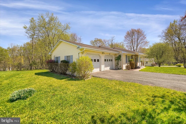 ranch-style house with an attached garage, a front lawn, and driveway