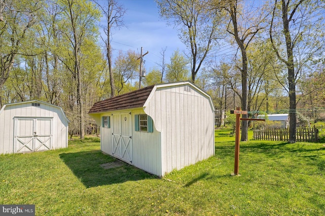 view of shed with fence