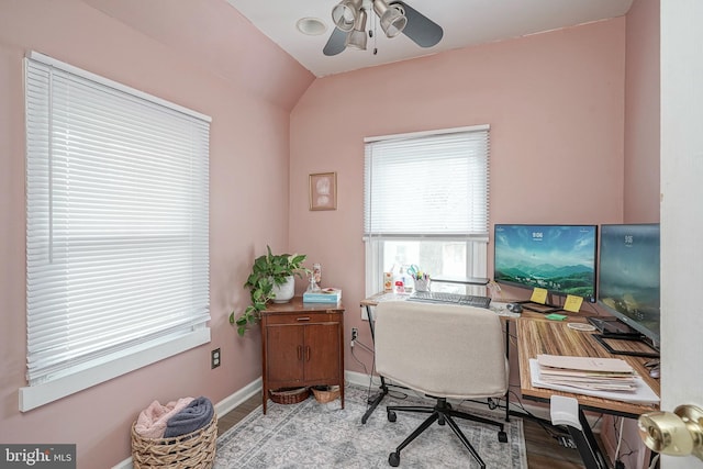office featuring baseboards, a ceiling fan, lofted ceiling, and wood finished floors