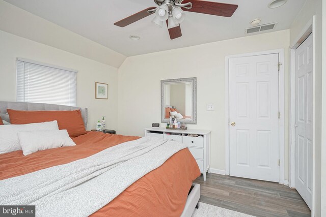 bedroom with visible vents, recessed lighting, a ceiling fan, light wood finished floors, and vaulted ceiling