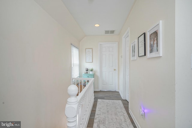 hall with recessed lighting, baseboards, visible vents, and dark wood finished floors