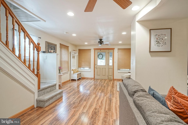 entryway featuring ceiling fan, recessed lighting, baseboards, light wood-type flooring, and stairway