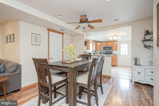 dining area with recessed lighting, ceiling fan, and light wood-style flooring