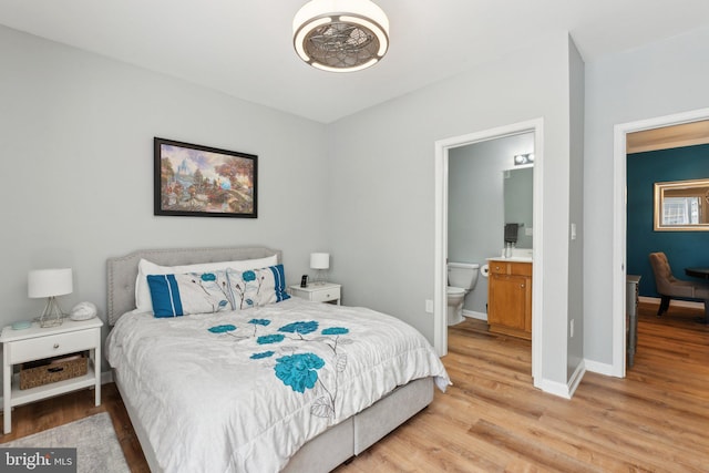 13347 Connor Dr Unit H, Centreville, VA 20120 - bedroom with light wood-type flooring, baseboards, and ensuite bath