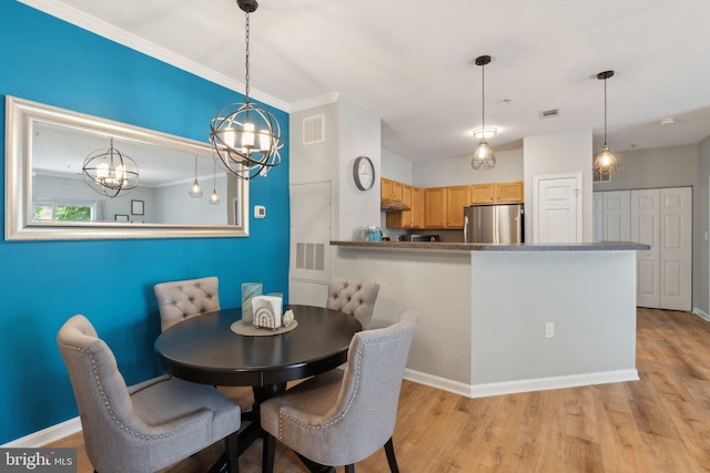 13347 Connor Dr Unit H, Centreville, VA 20120 - dining room featuring a chandelier, light wood-style floors, crown molding, and baseboards