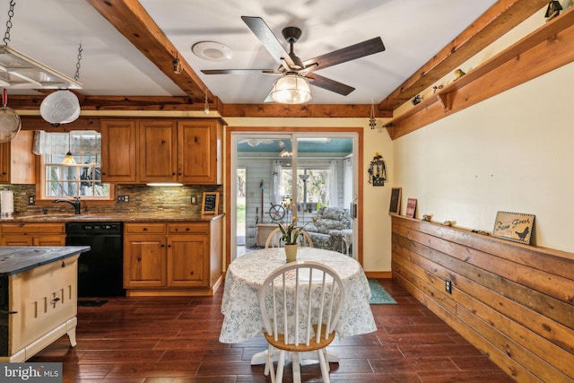 kitchen with beam ceiling, dark wood-style flooring, and black dishwasher