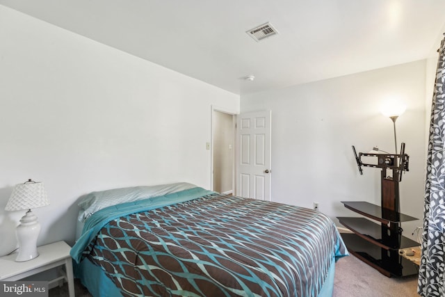 carpeted bedroom with visible vents