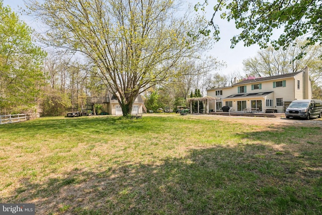 view of yard with fence and a deck