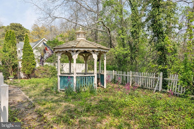 view of yard featuring fence and a gazebo