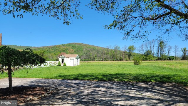 mountain view featuring a rural view