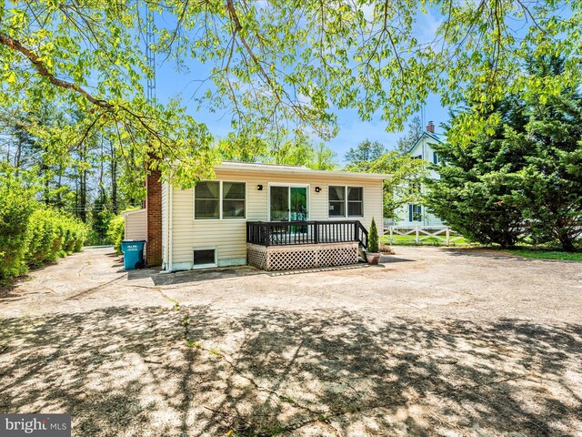 rear view of property with a deck