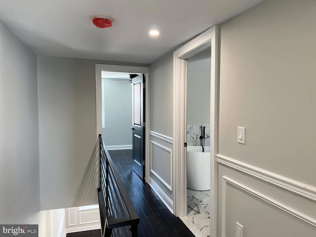 hall with wood finished floors