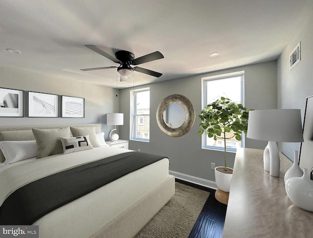 bedroom featuring dark wood-style flooring, a ceiling fan, baseboards, recessed lighting, and visible vents