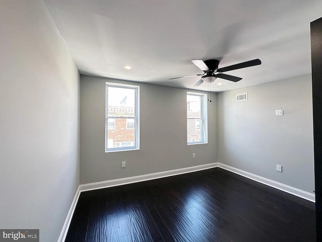 unfurnished room with visible vents, baseboards, ceiling fan, dark wood-type flooring, and recessed lighting