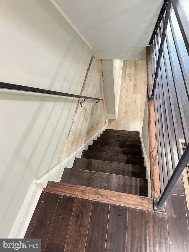 stairs with wood finished floors