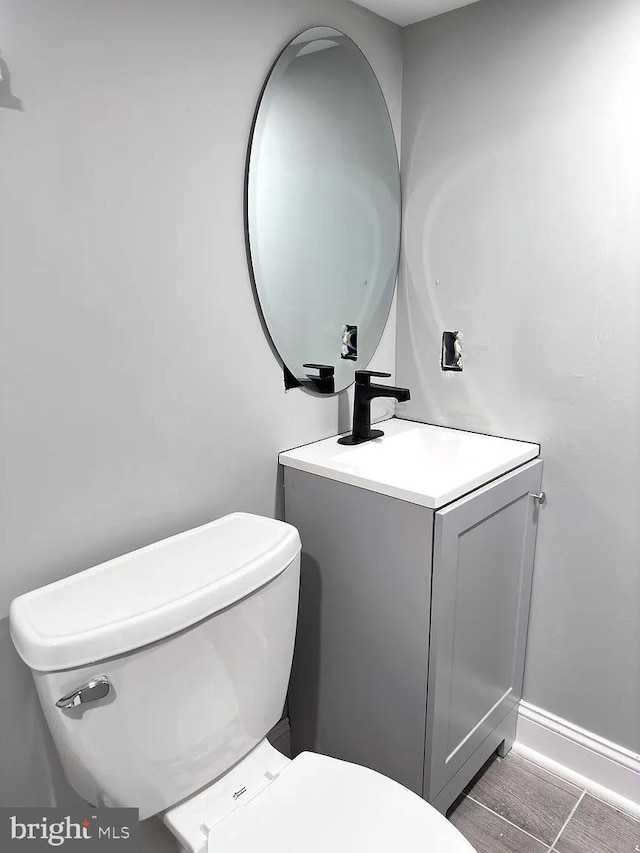 bathroom with vanity and toilet