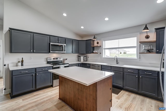 147 Langley Dr, Waynesboro, VA 22980 - kitchen with open shelves, a sink, light wood finished floors, lofted ceiling, and stainless steel appliances