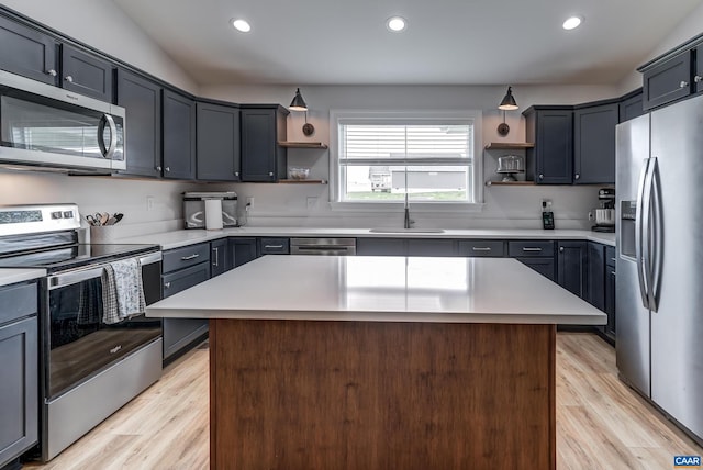 147 Langley Dr, Waynesboro, VA 22980 - kitchen with open shelves, appliances with stainless steel finishes, a sink, and light wood finished floors