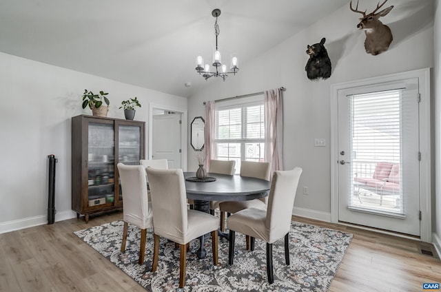 147 Langley Dr, Waynesboro, VA 22980 - dining room with baseboards, a notable chandelier, lofted ceiling, and light wood-style floors