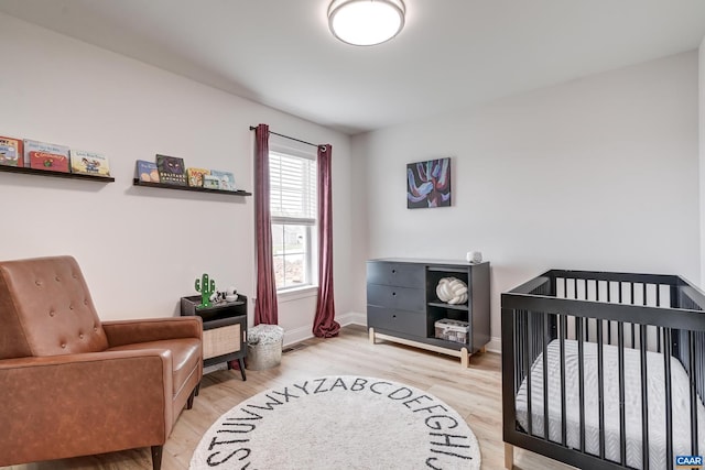 147 Langley Dr, Waynesboro, VA 22980 - bedroom featuring baseboards, wood finished floors, and a crib