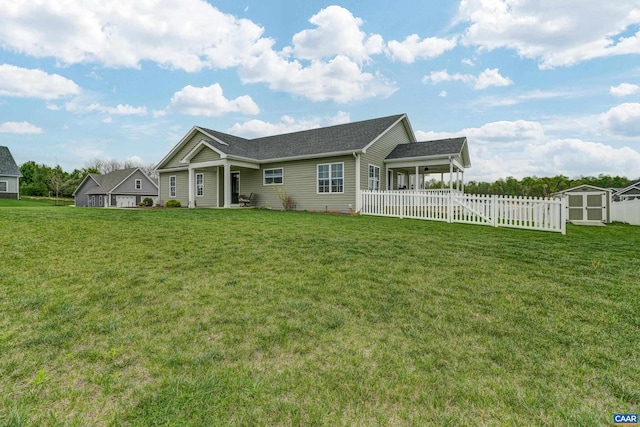 147 Langley Dr, Waynesboro, VA 22980 - view of front of home featuring fence, an outbuilding, a front lawn, and a storage unit