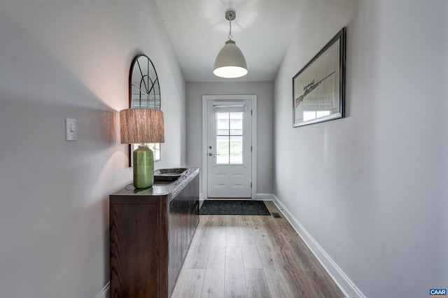 147 Langley Dr, Waynesboro, VA 22980 - doorway with baseboards, wood finished floors, and visible vents