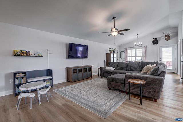 147 Langley Dr, Waynesboro, VA 22980 - living area featuring baseboards, ceiling fan with notable chandelier, wood finished floors, and vaulted ceiling