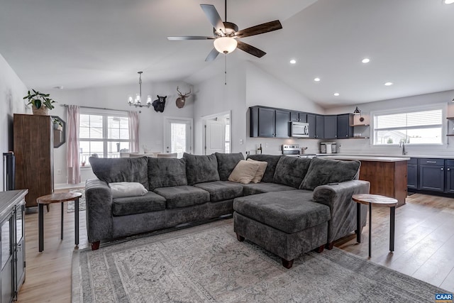 147 Langley Dr, Waynesboro, VA 22980 - living room featuring recessed lighting, vaulted ceiling, ceiling fan with notable chandelier, and light wood-style floors