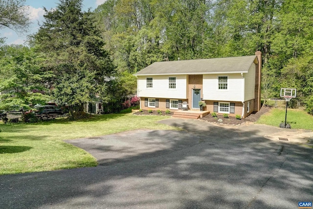 209 Old Lynchburg Rd, Charlottesville, VA 22903 - raised ranch with brick siding, a chimney, and a front yard