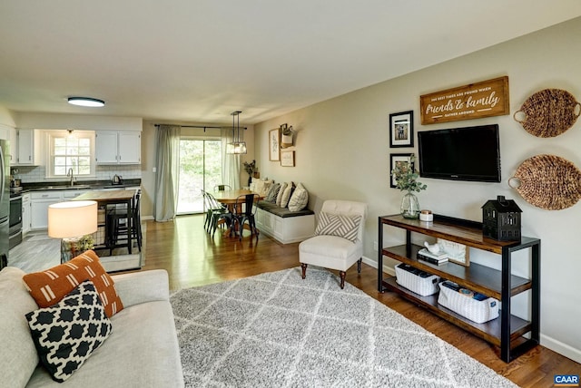 209 Old Lynchburg Rd, Charlottesville, VA 22903 - living room featuring baseboards and wood finished floors