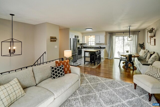 209 Old Lynchburg Rd, Charlottesville, VA 22903 - living area with wood finished floors and a chandelier