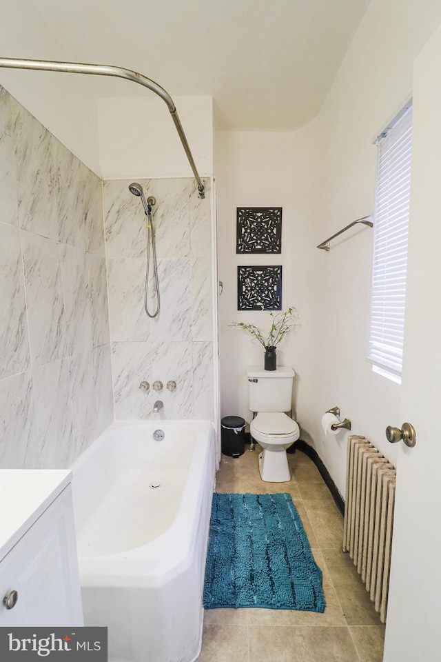 full bathroom featuring toilet, bathing tub / shower combination, tile patterned floors, radiator heating unit, and vanity
