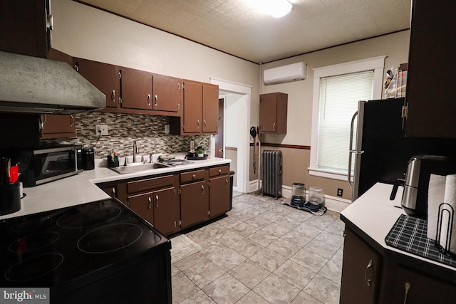 kitchen with decorative backsplash, a sink, radiator, electric range, and a wall mounted air conditioner