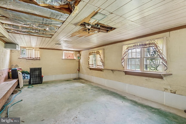 below grade area with wooden ceiling and plenty of natural light