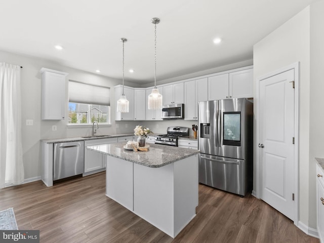 1022 Fawn Haven Walk, Dover, DE 19901 - kitchen with a sink, dark wood-style flooring, white cabinets, and stainless steel appliances