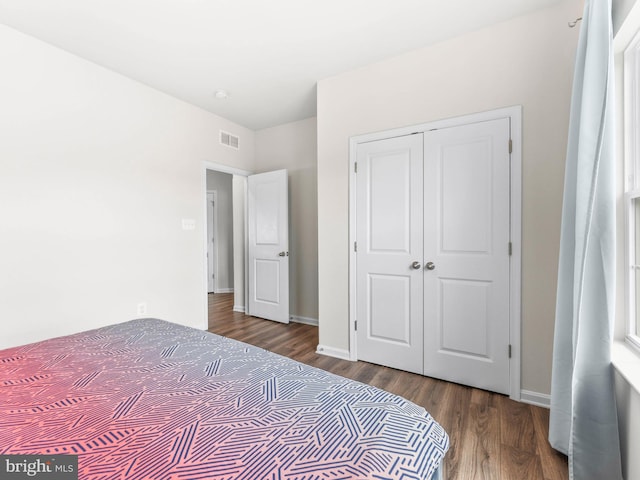 1022 Fawn Haven Walk, Dover, DE 19901 - bedroom featuring visible vents, baseboards, wood finished floors, and a closet