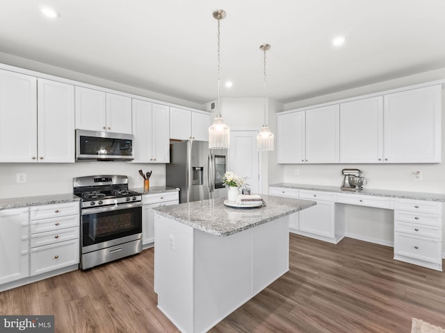 1022 Fawn Haven Walk, Dover, DE 19901 - kitchen with dark wood-type flooring, a center island, white cabinets, and stainless steel appliances