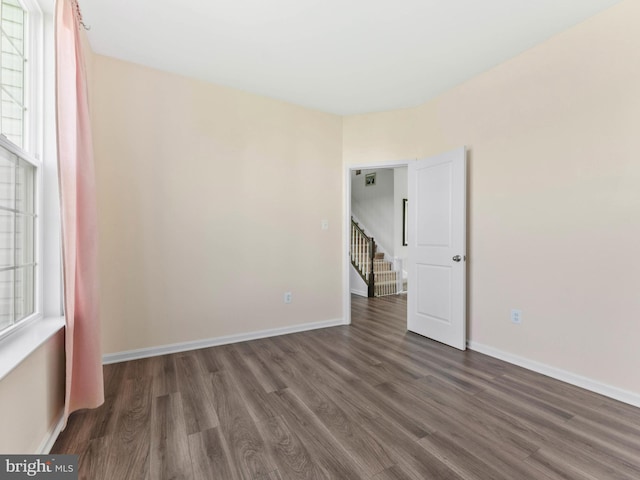 1022 Fawn Haven Walk, Dover, DE 19901 - spare room with baseboards, wood finished floors, and stairway