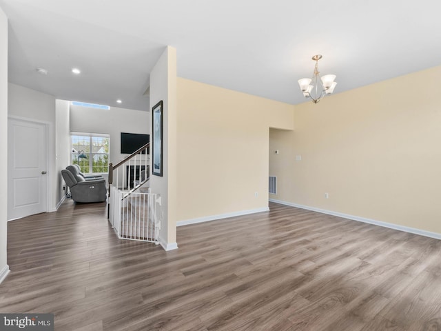 1022 Fawn Haven Walk, Dover, DE 19901 - spare room featuring visible vents, baseboards, wood finished floors, and a chandelier