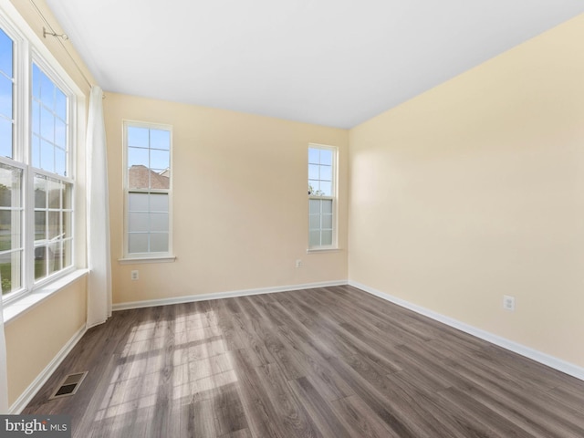 1022 Fawn Haven Walk, Dover, DE 19901 - unfurnished room with visible vents, dark wood finished floors, and baseboards