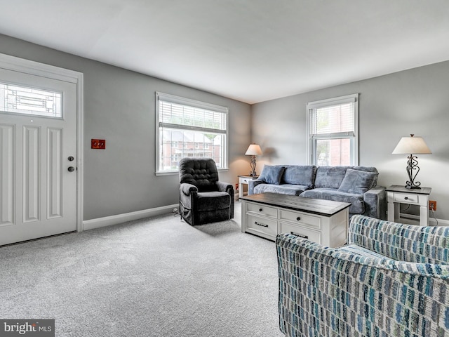 7612 Daniels Ave, Baltimore, MD 21234 - living area featuring plenty of natural light, light carpet, and baseboards