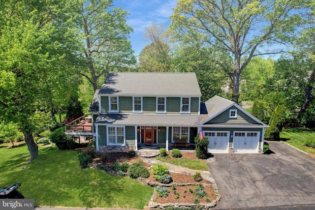 9373 Robnel Pl, Vienna, VA 22182 - colonial inspired home with roof with shingles, a front lawn, aphalt driveway, a garage, and covered porch