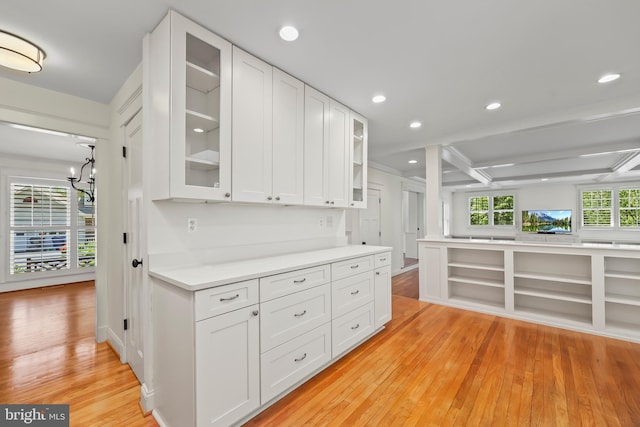 9373 Robnel Pl, Vienna, VA 22182 - kitchen featuring white cabinets, light wood finished floors, light countertops, recessed lighting, and glass insert cabinets