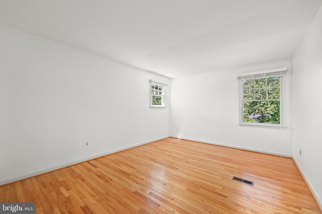 9373 Robnel Pl, Vienna, VA 22182 - empty room with plenty of natural light, baseboards, visible vents, and hardwood / wood-style floors