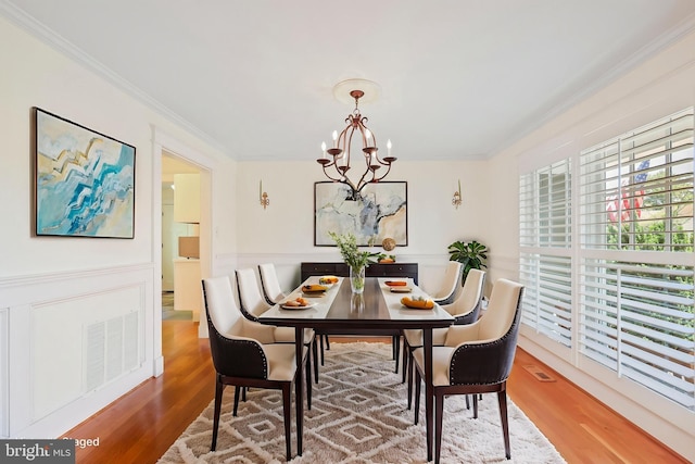9373 Robnel Pl, Vienna, VA 22182 - dining space featuring an inviting chandelier, ornamental molding, and wood finished floors