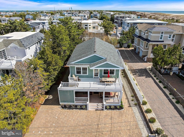 birds eye view of property with a residential view