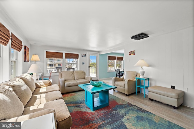 living room featuring baseboards and wood finished floors