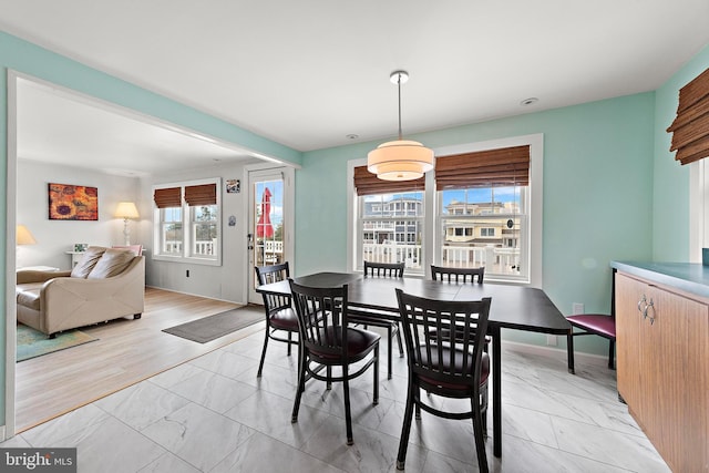 dining room with marble finish floor