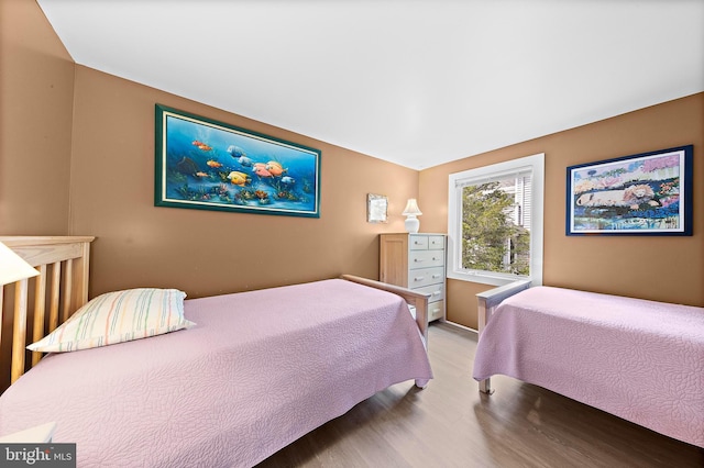 bedroom featuring wood finished floors